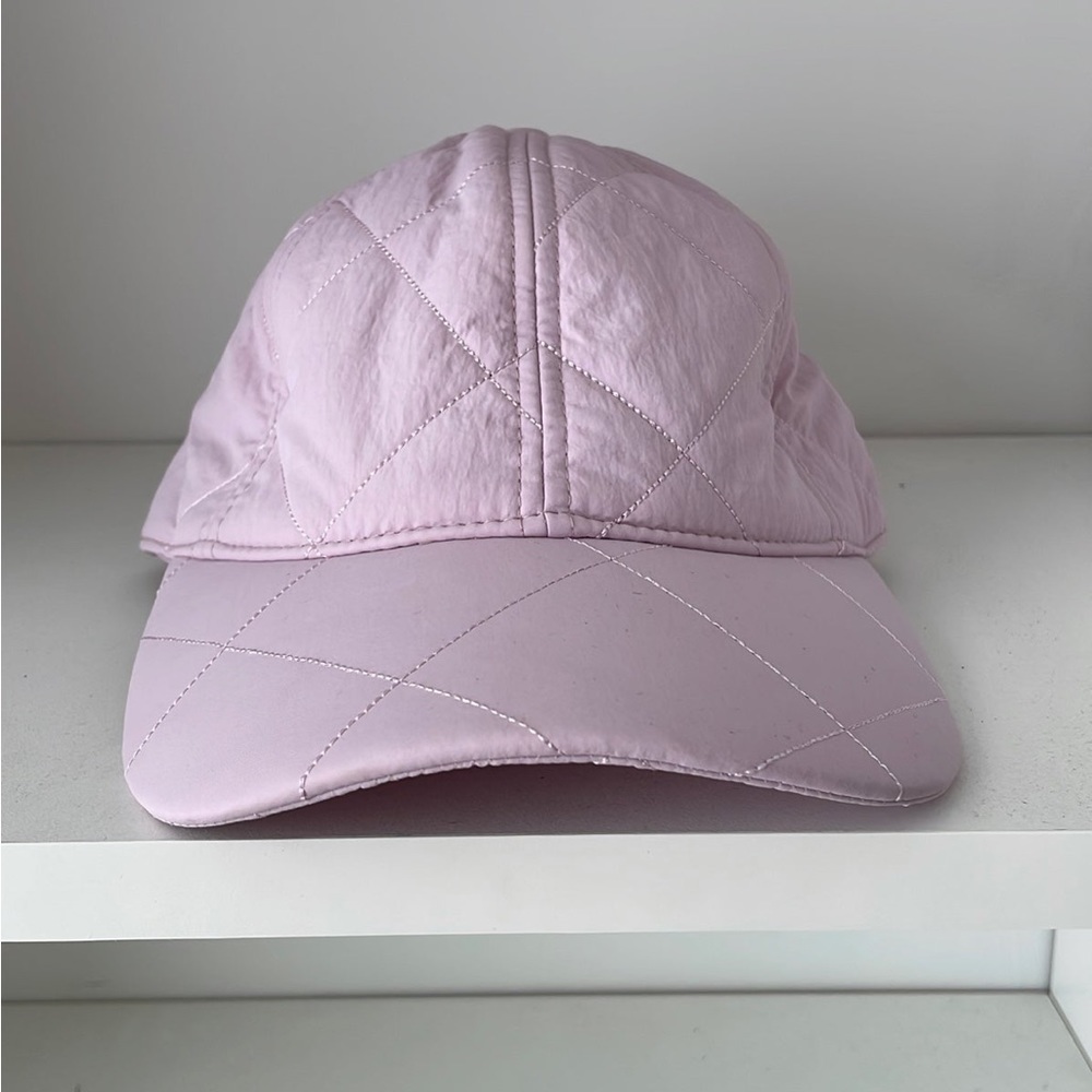 Quilted hat with adjustable strap